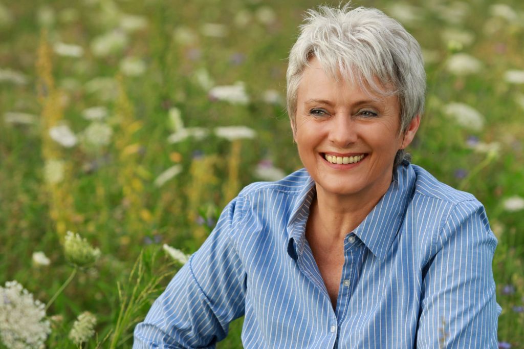 resizeCanva - Happy attractive senior woman in a flowerfield