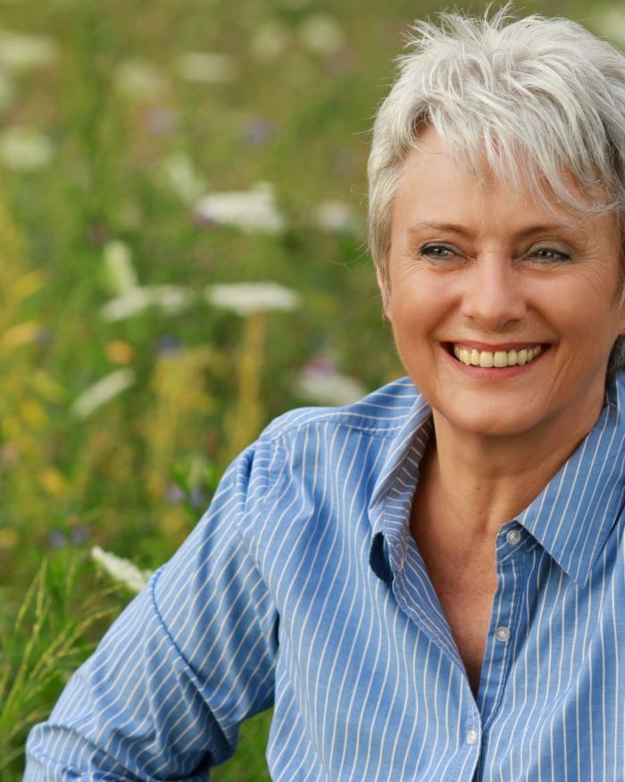 resizeCanva - Happy attractive senior woman in a flowerfield