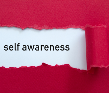image-of-red-paper-torn-to-reveal-white-background-and-words-self-awareness
